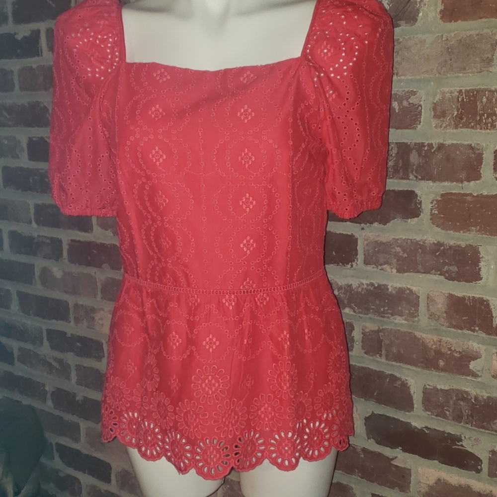 Pink eyelet lace blouse.